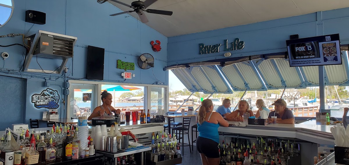 Whiskey River's indoor bar opens toward the waterfront