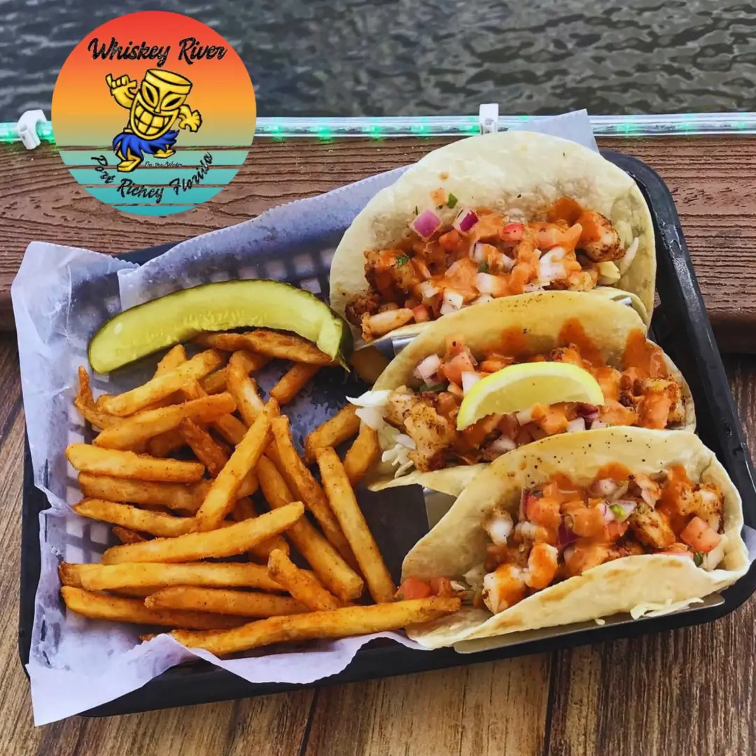 Tacos and fries beside the water at Whiskey River