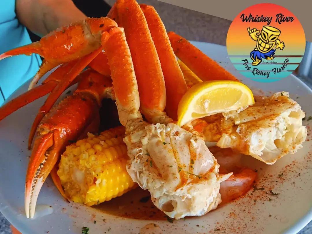 A plate of crab legs and corn at Whiskey River